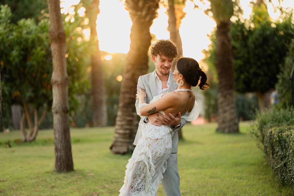 Joyful bride and groom dancing at reception